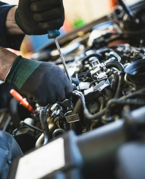 Mechanic inspecting engine